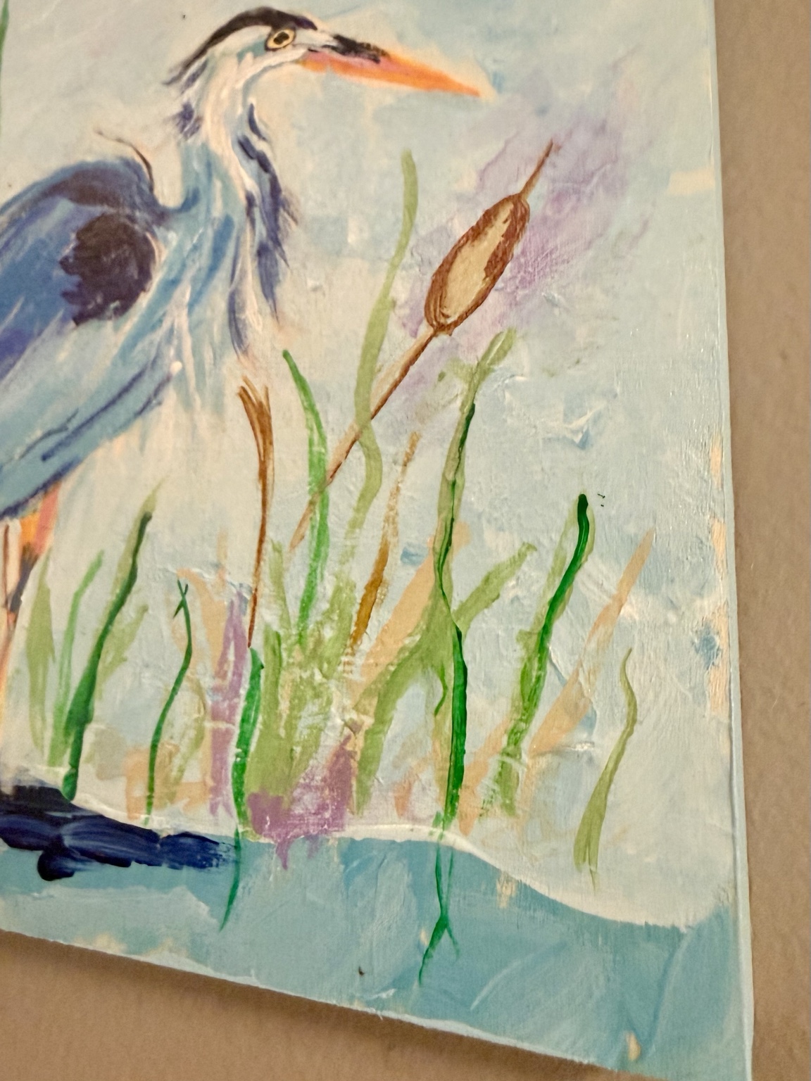 Angled view showing the heron painting's edge