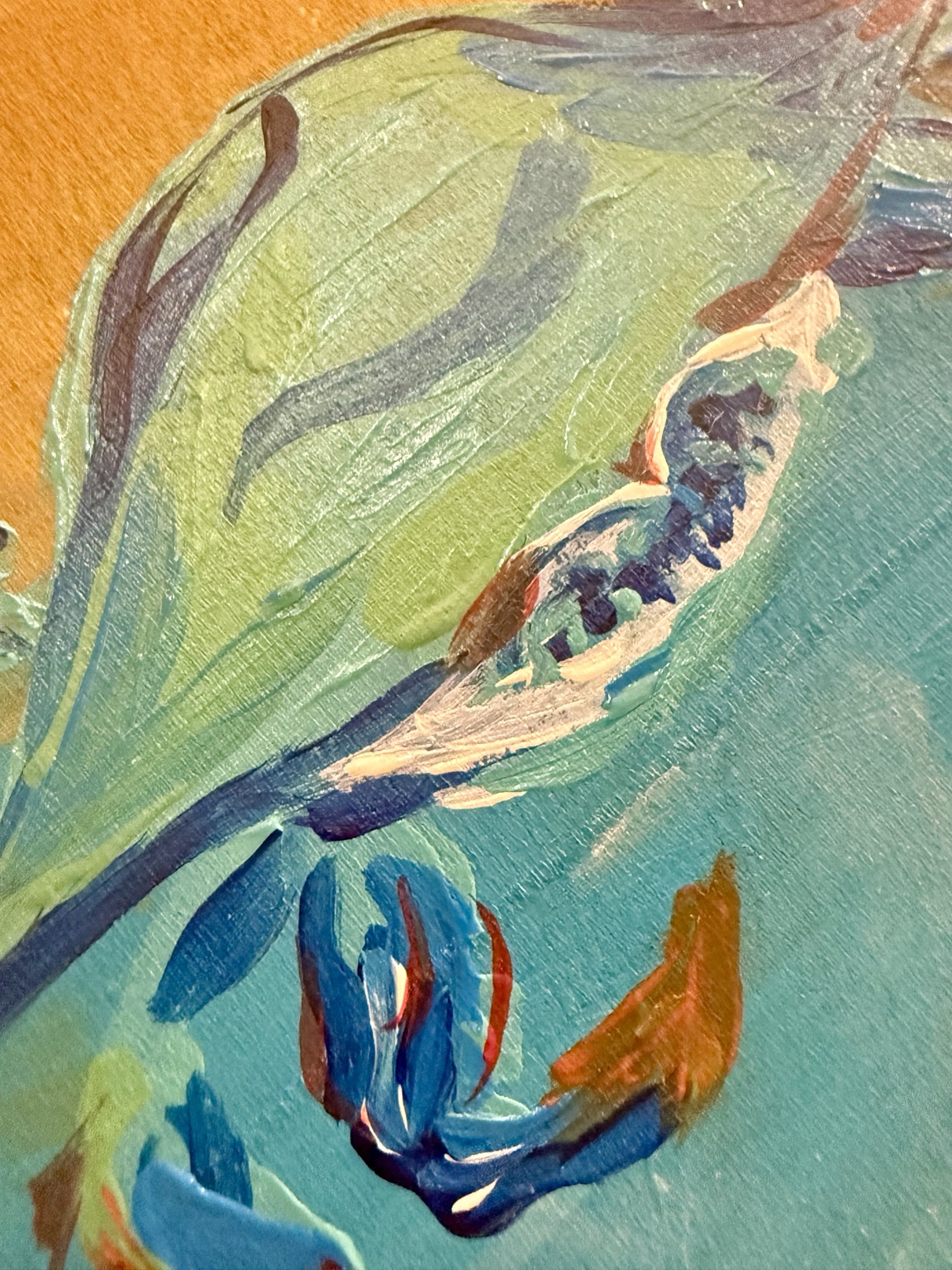 Close-up of the blue crab's colorful claws and textured paint