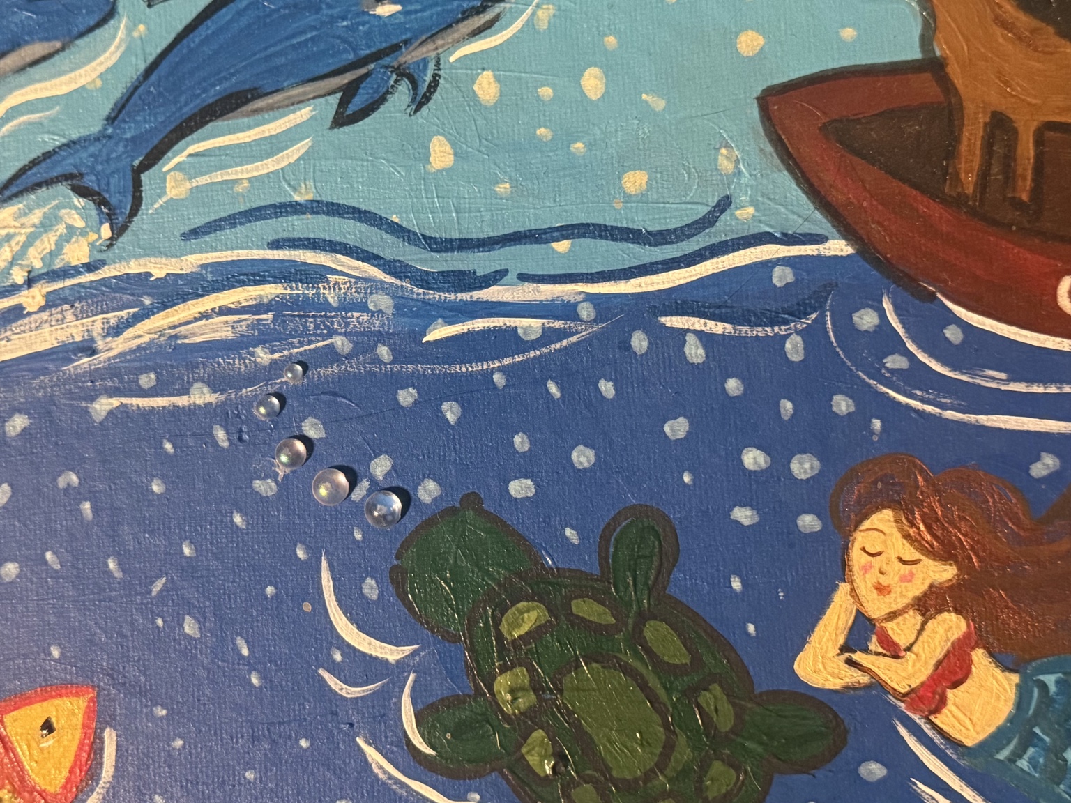Close-up of the sea turtle and mermaid in blue waves