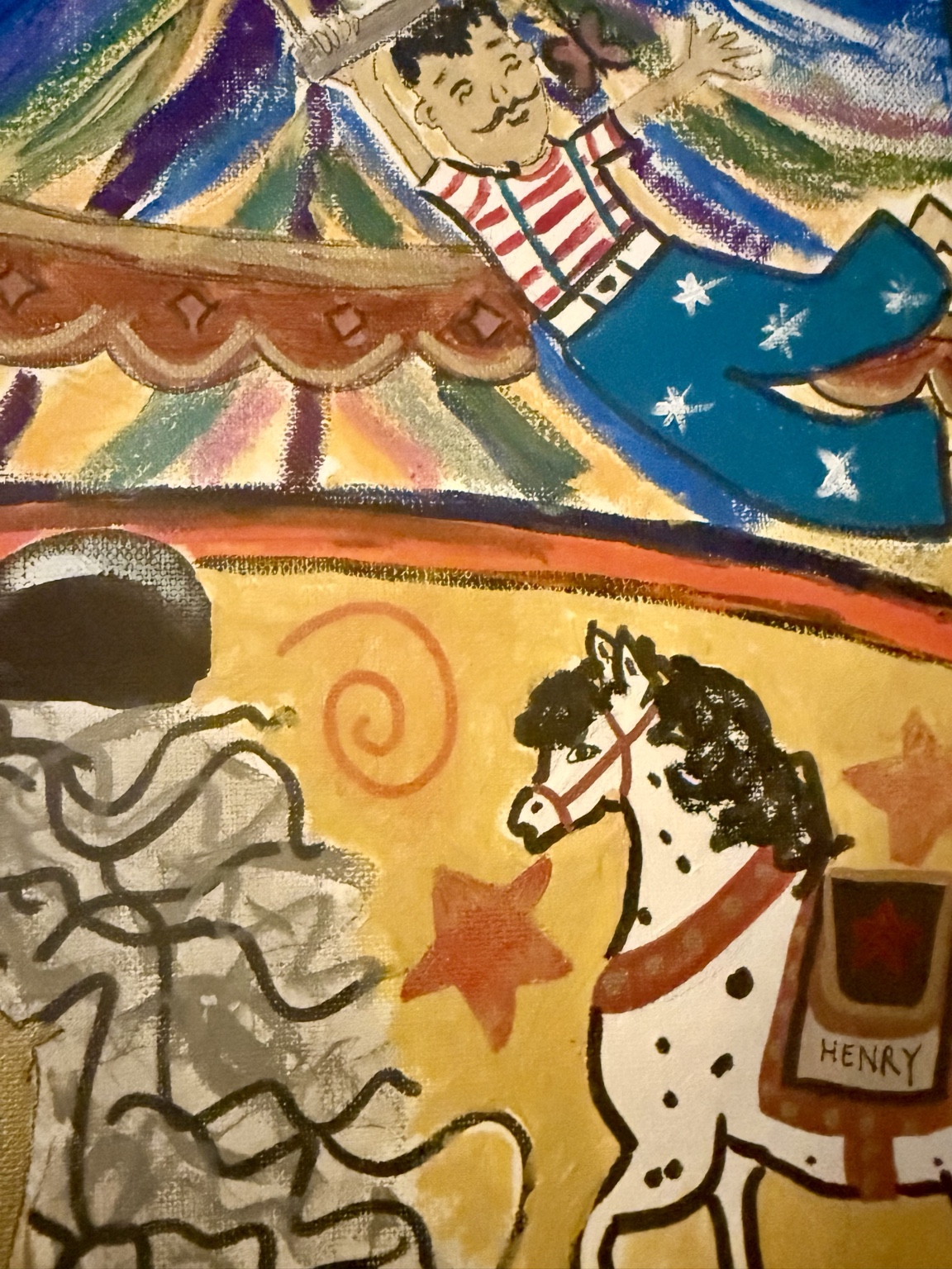 Close-up of the trapeze performer and horse in the circus scene
