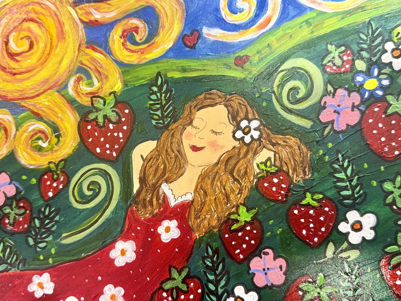 Close-up of the girl and painted strawberries