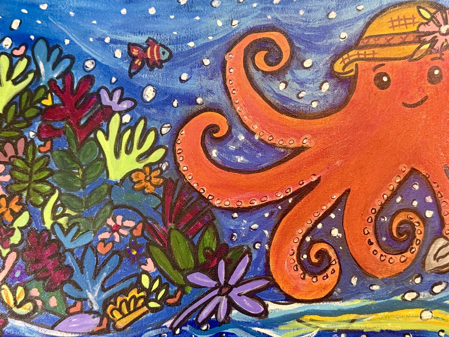 Close-up of the orange octopus and textured sea
