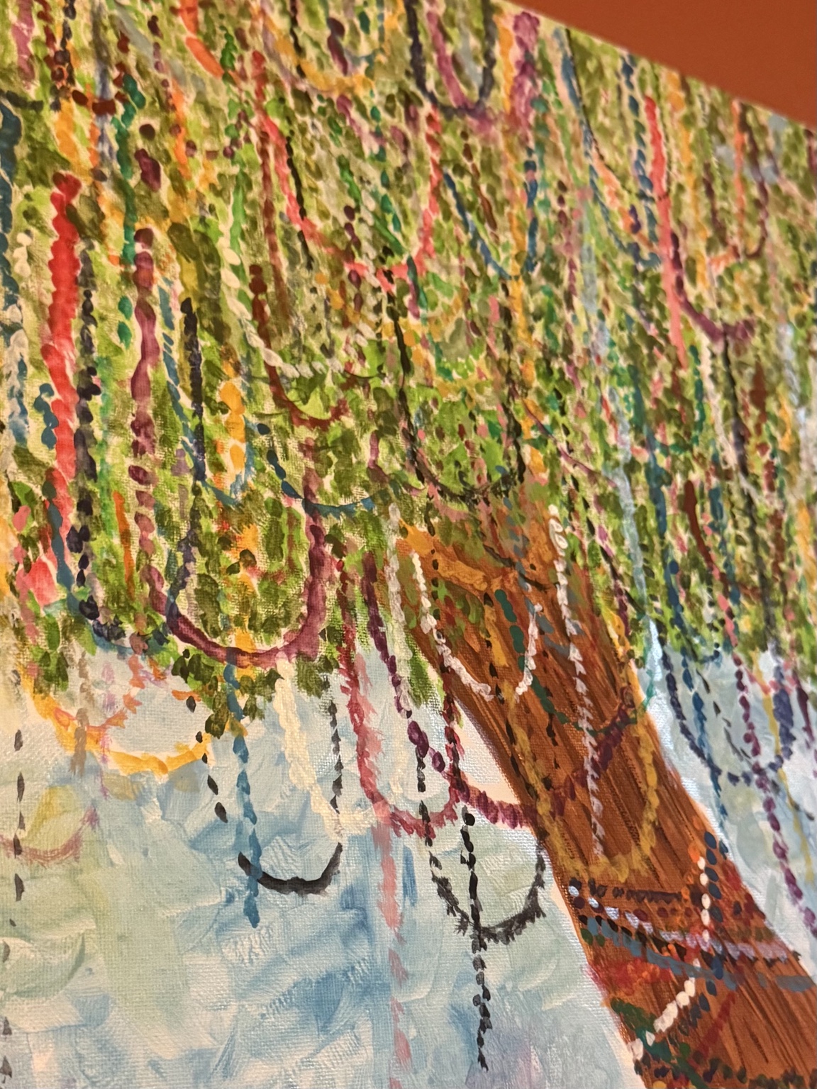 Close-up of colorful beads hanging from tree branches