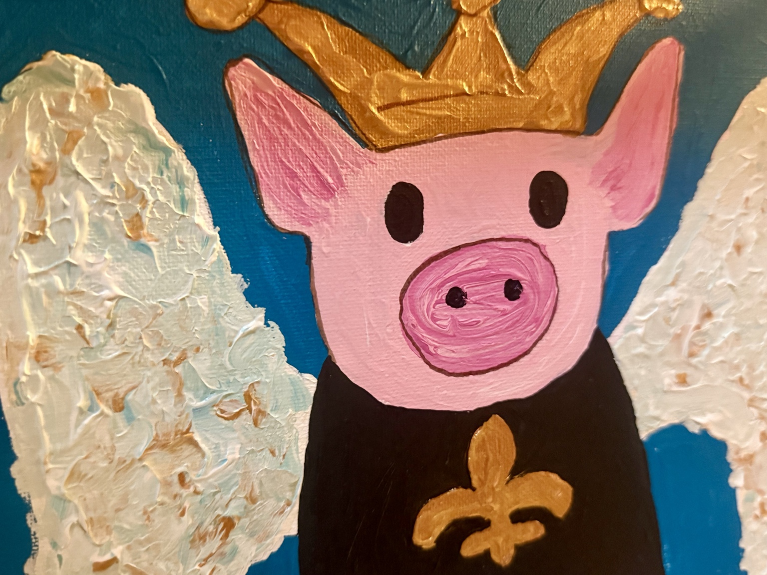 Close-up of the crowned pink pig and textured wings