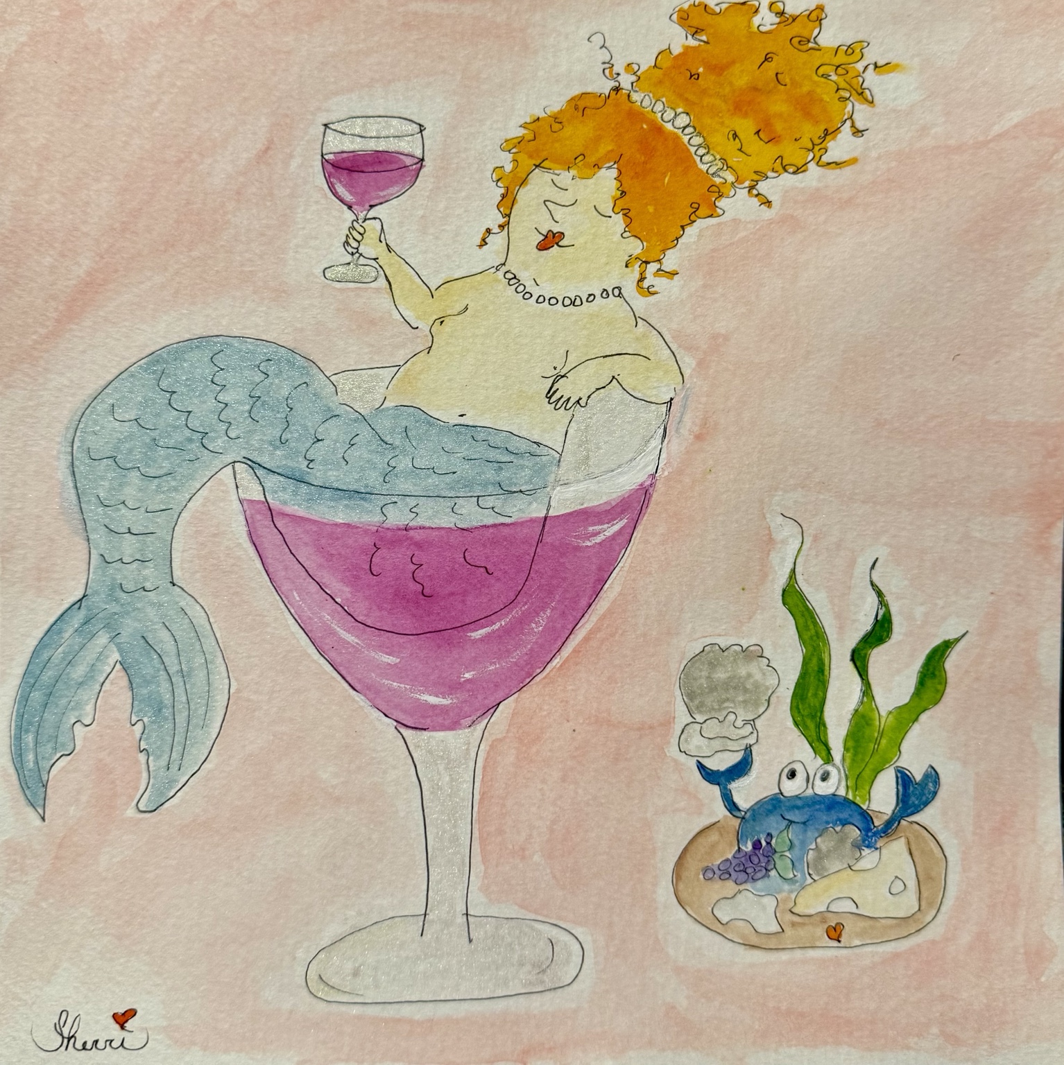 Mabel the mermaid lounges in a pink wine glass holding a smaller glass, with a blue crab nearby