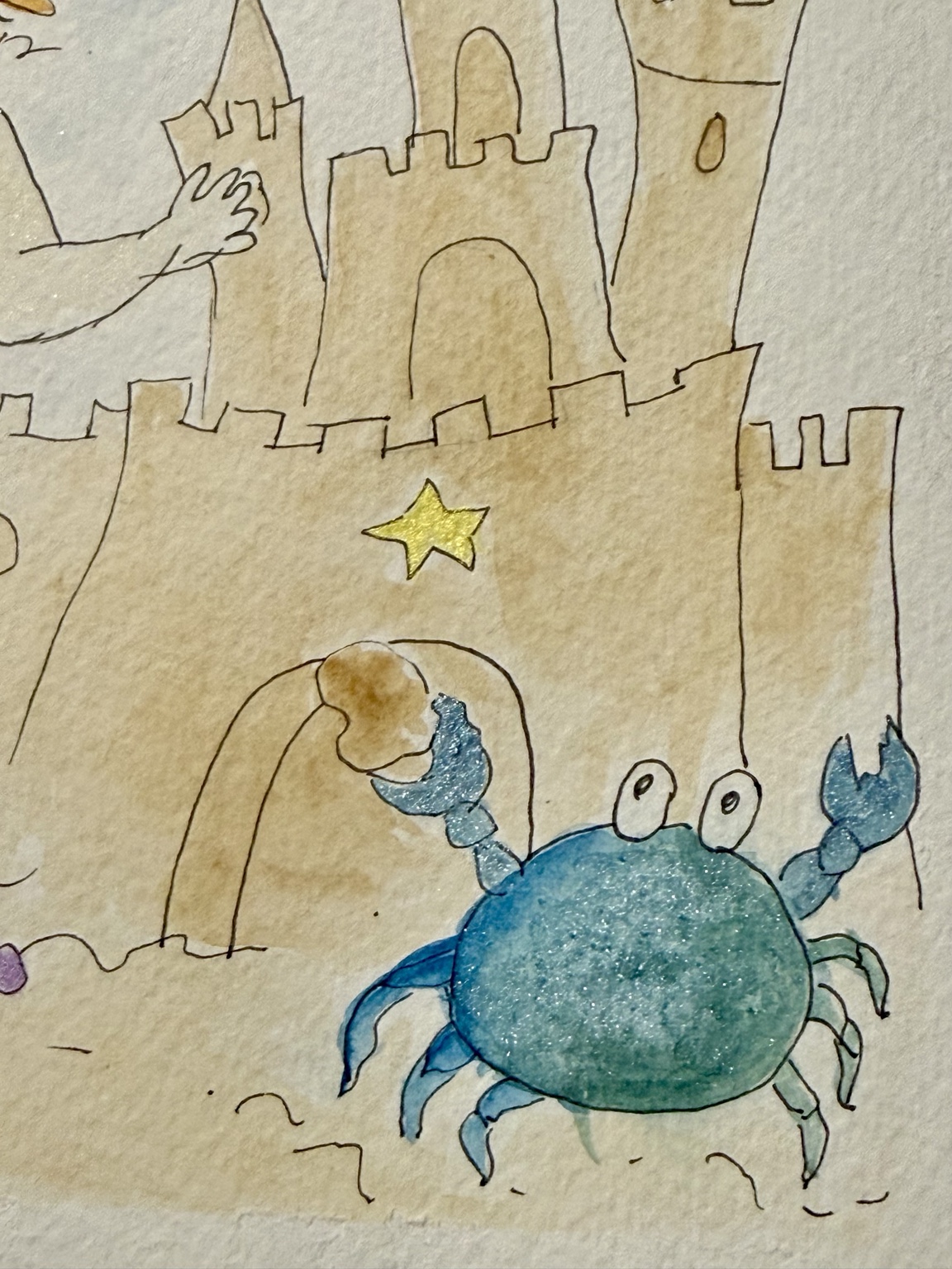 Close-up of the sandcastle and blue crab