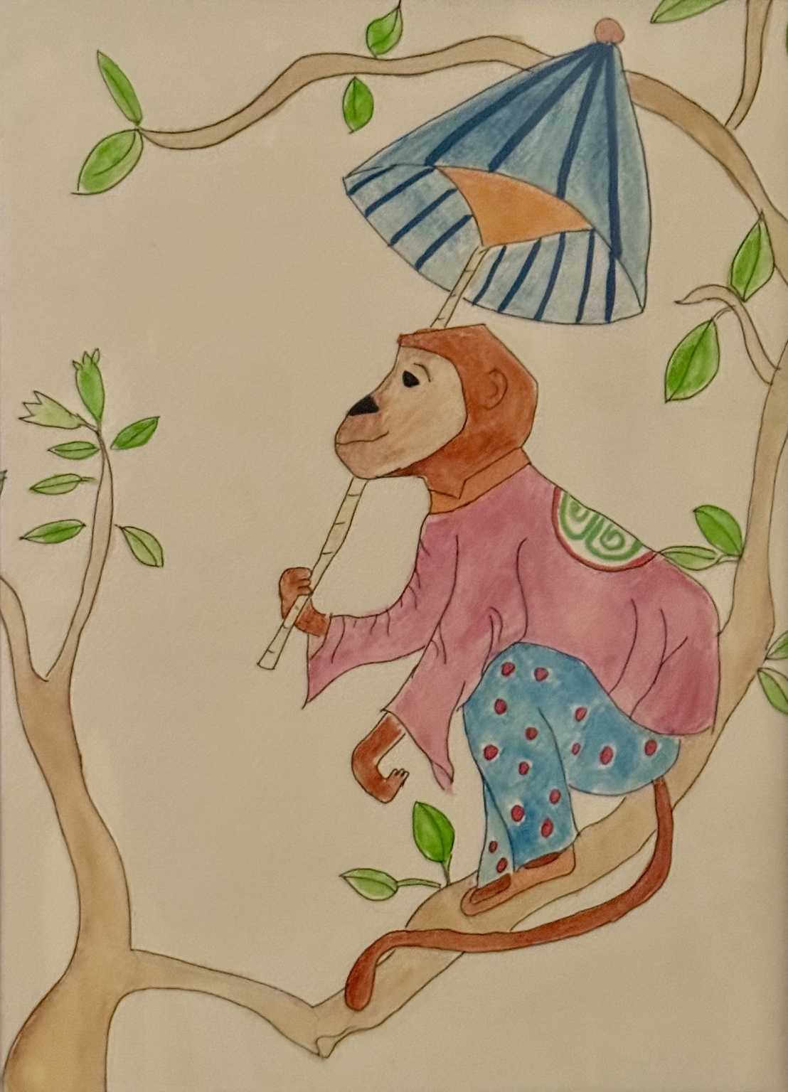 Monkey in a pink coat perched in a tree with a blue umbrella
