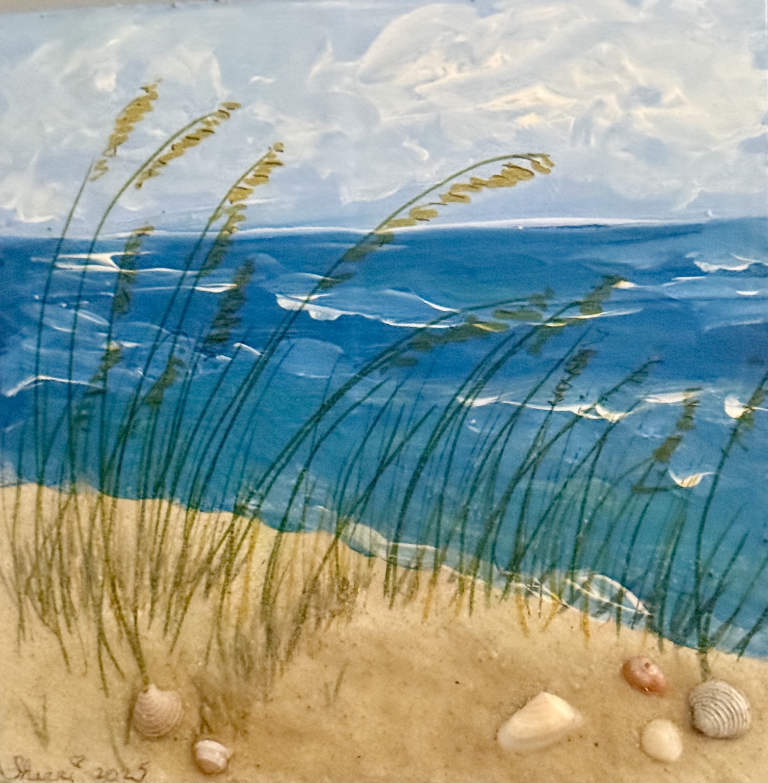 Beach grasses and shells beside the sea