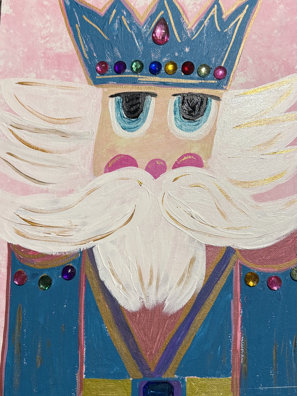 Portrait of a nutcracker wearing a jeweled blue crown