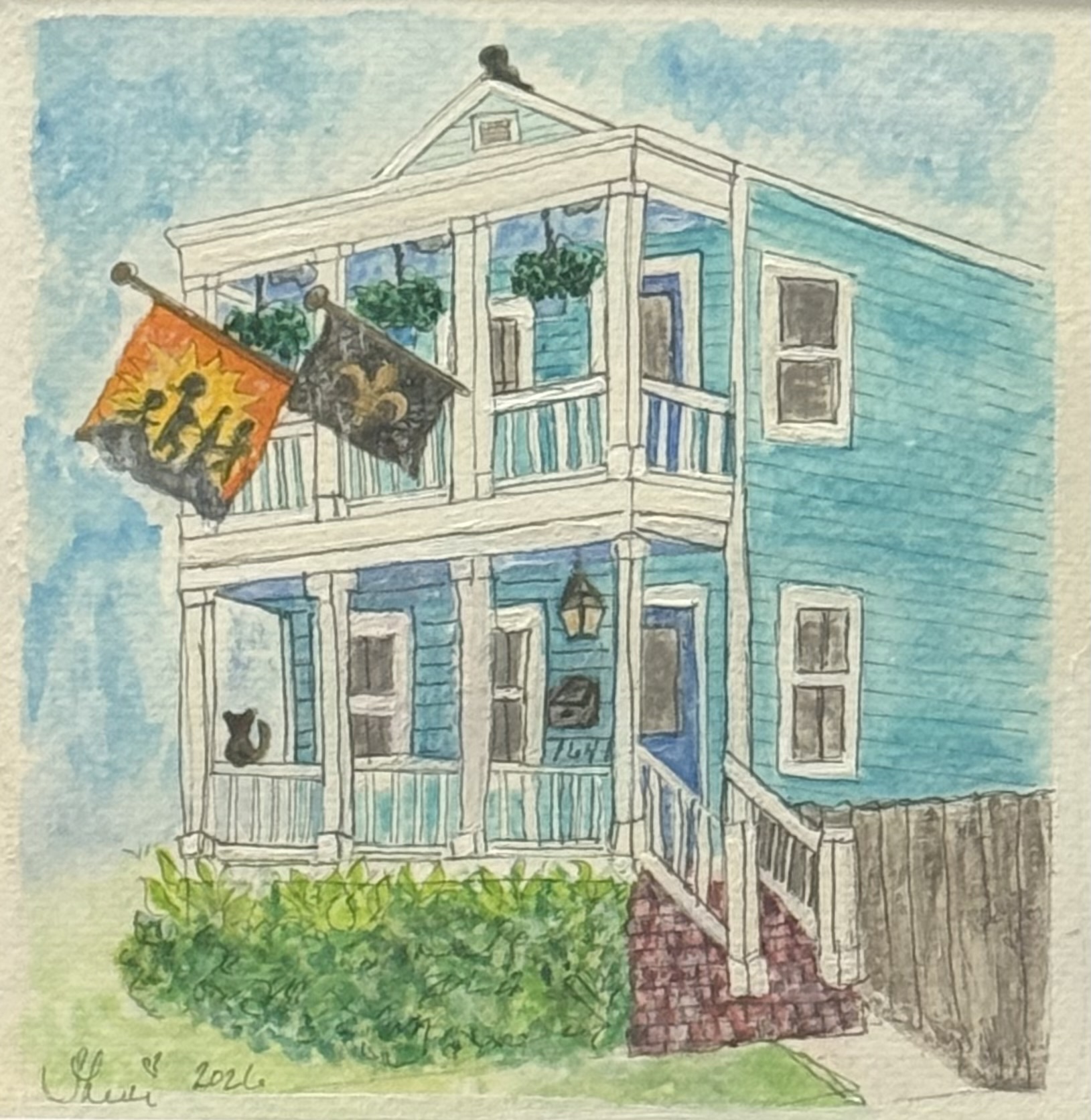 Teal New Orleans house with flags, plants, and a cat
