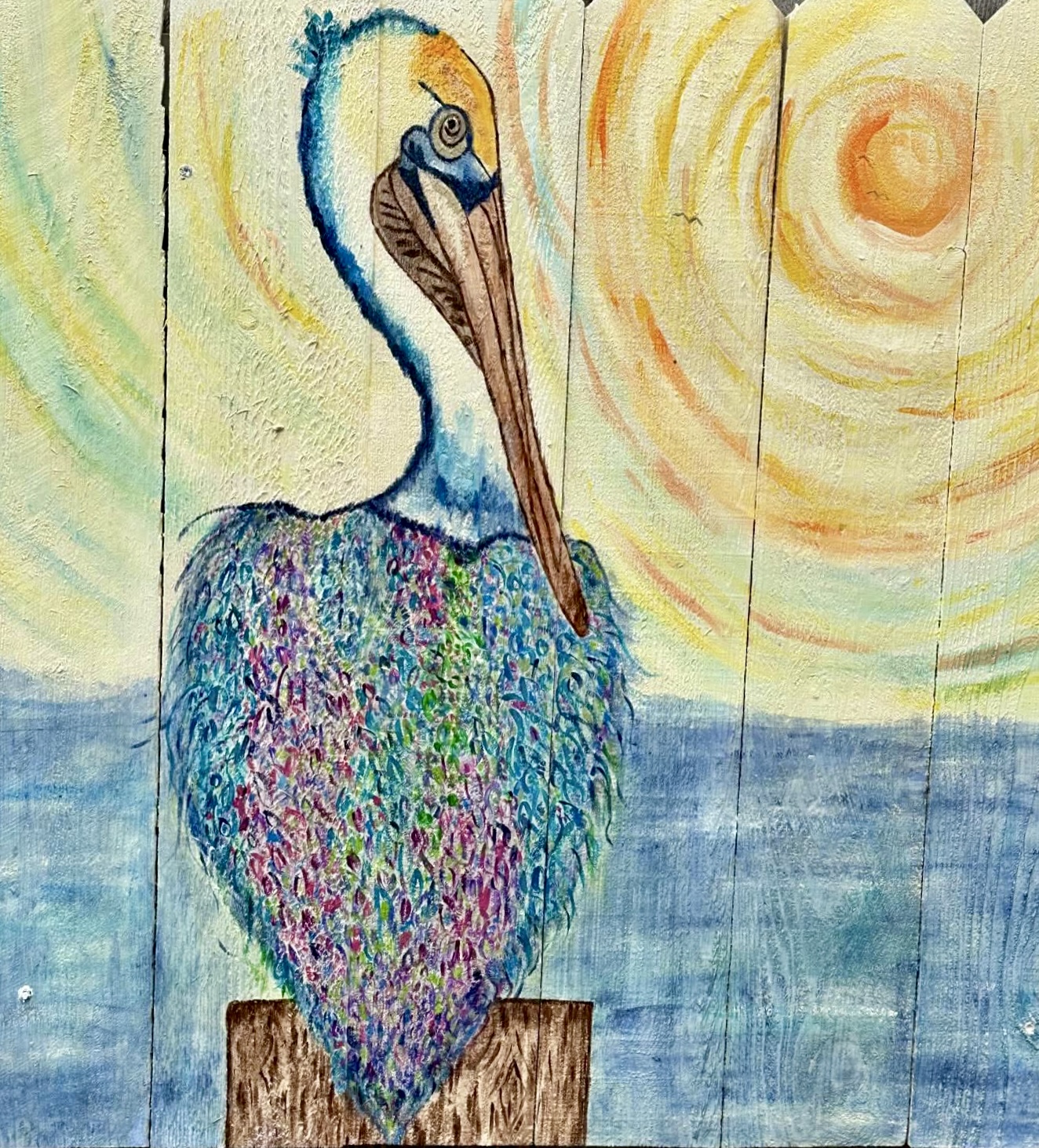Colorful pelican perched by the water beneath a swirling sun