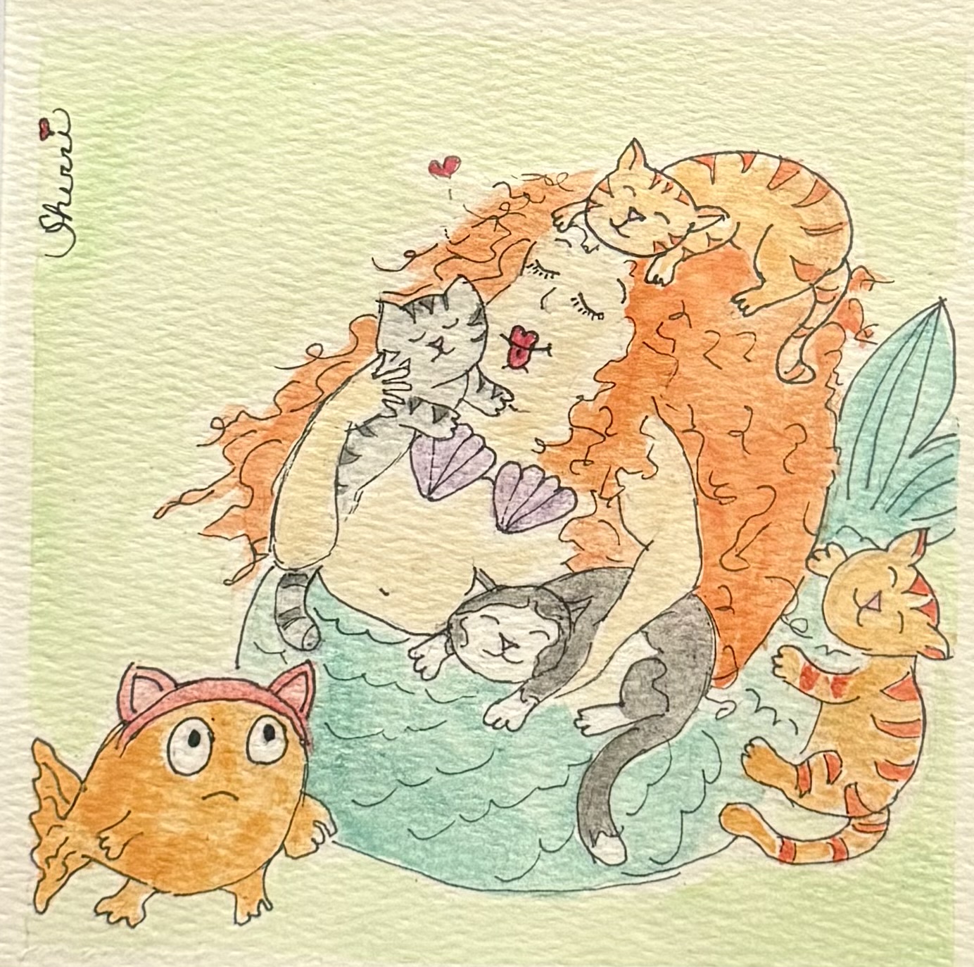 Mabel the mermaid with several cats and Nugget the fish