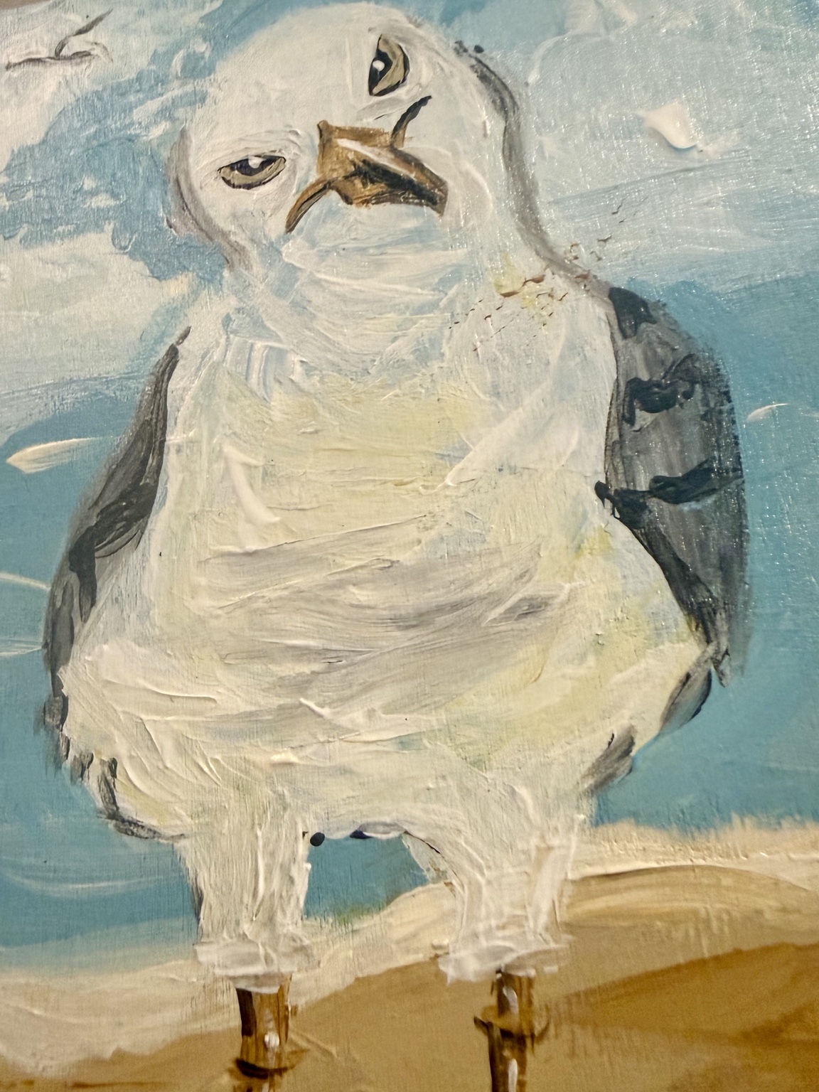 Close-up showing the textured paint and expression of the seagull