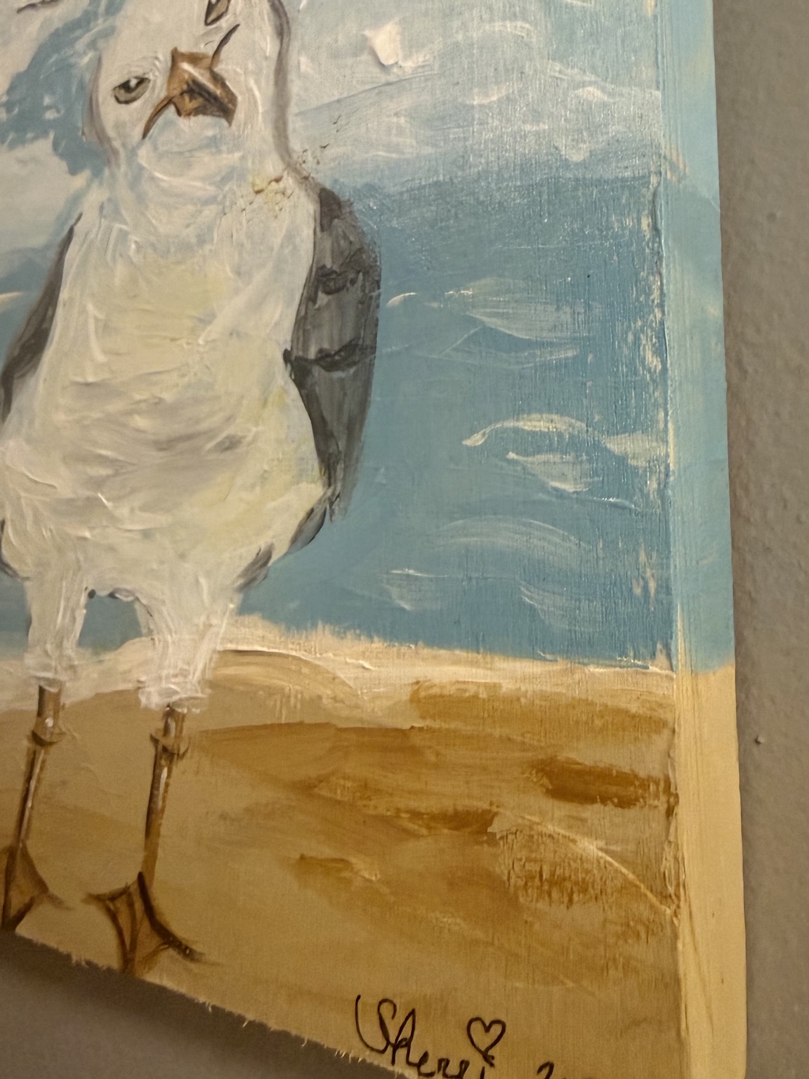 Angled view showing the painted side of the seagull artwork