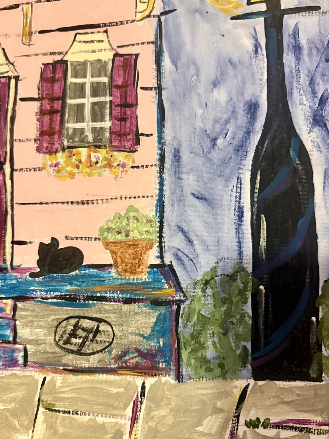 Close-up of the burgundy door, porch, and black cat