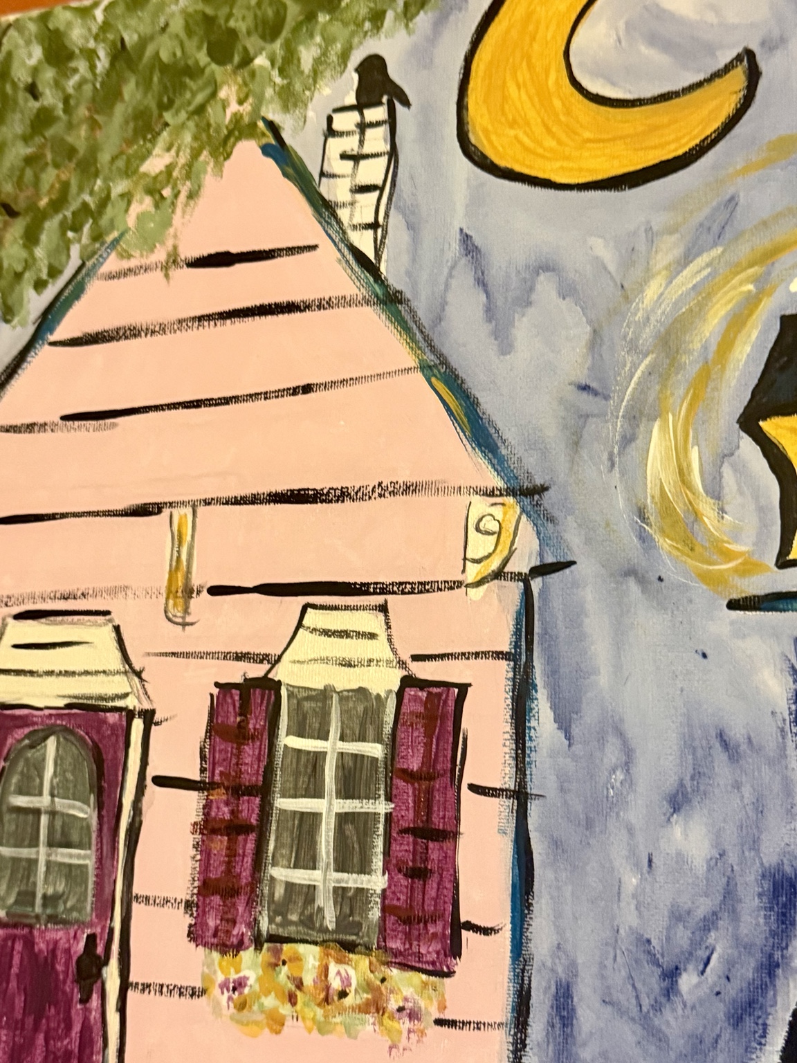 Close-up of the cottage roof and crescent moon