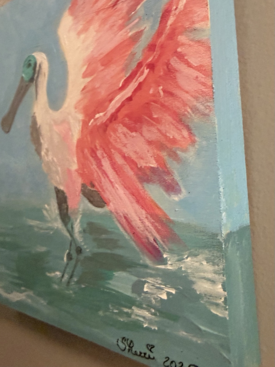 Angled view of the spoonbill painting and its turquoise painted edge