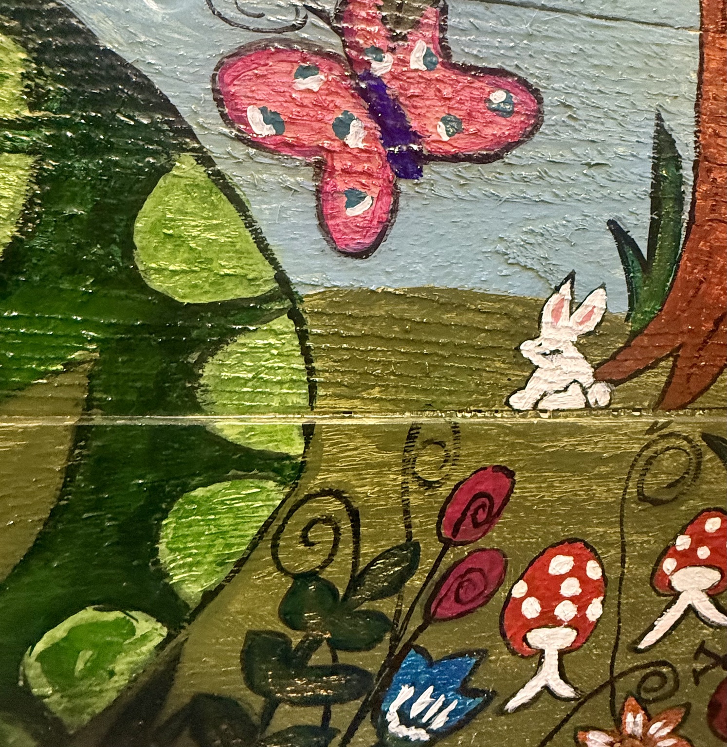 Close-up of the alligator, rabbit, and butterflies